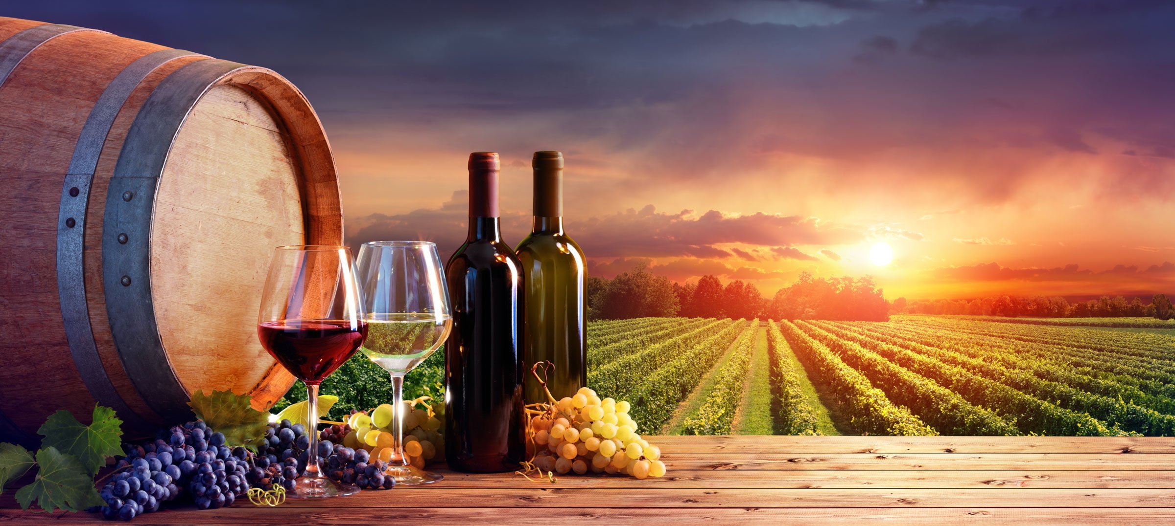 Wine on a table with Tuscany vineyard in background